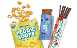 A variety of Little Spoon snacks, including a bag of Veggie Loops, an Oat Bar, and a Fruit Ripper.