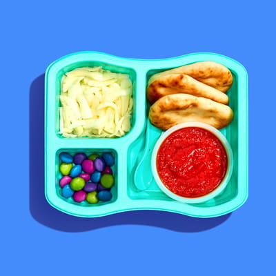 One Little Spoon luncher tray on a blue background